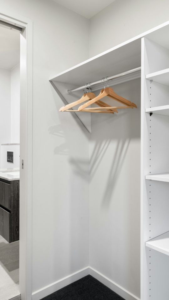 white wooden shelf with mirror